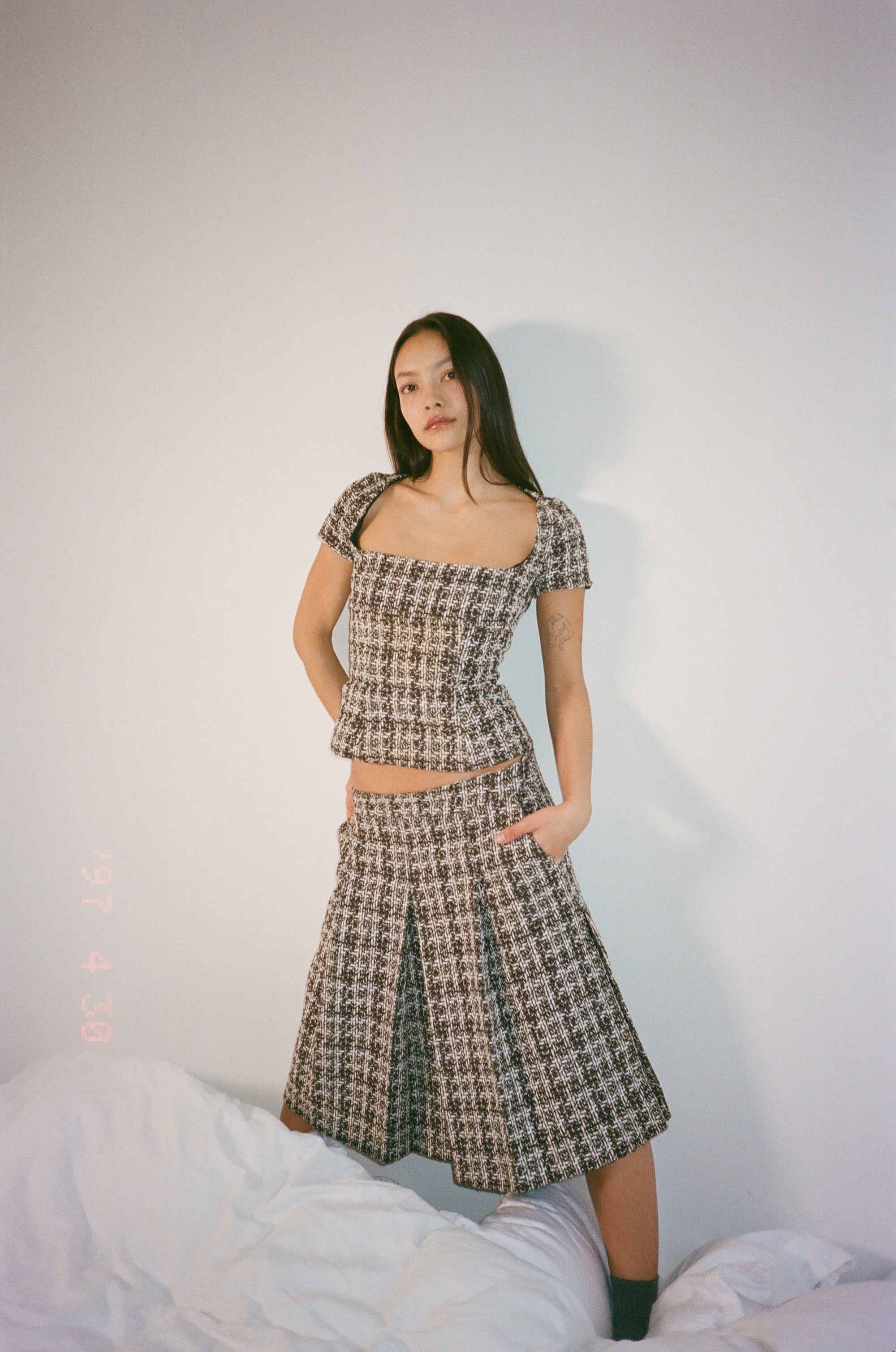 Corset top in burgundy checkered bouclé wool blend