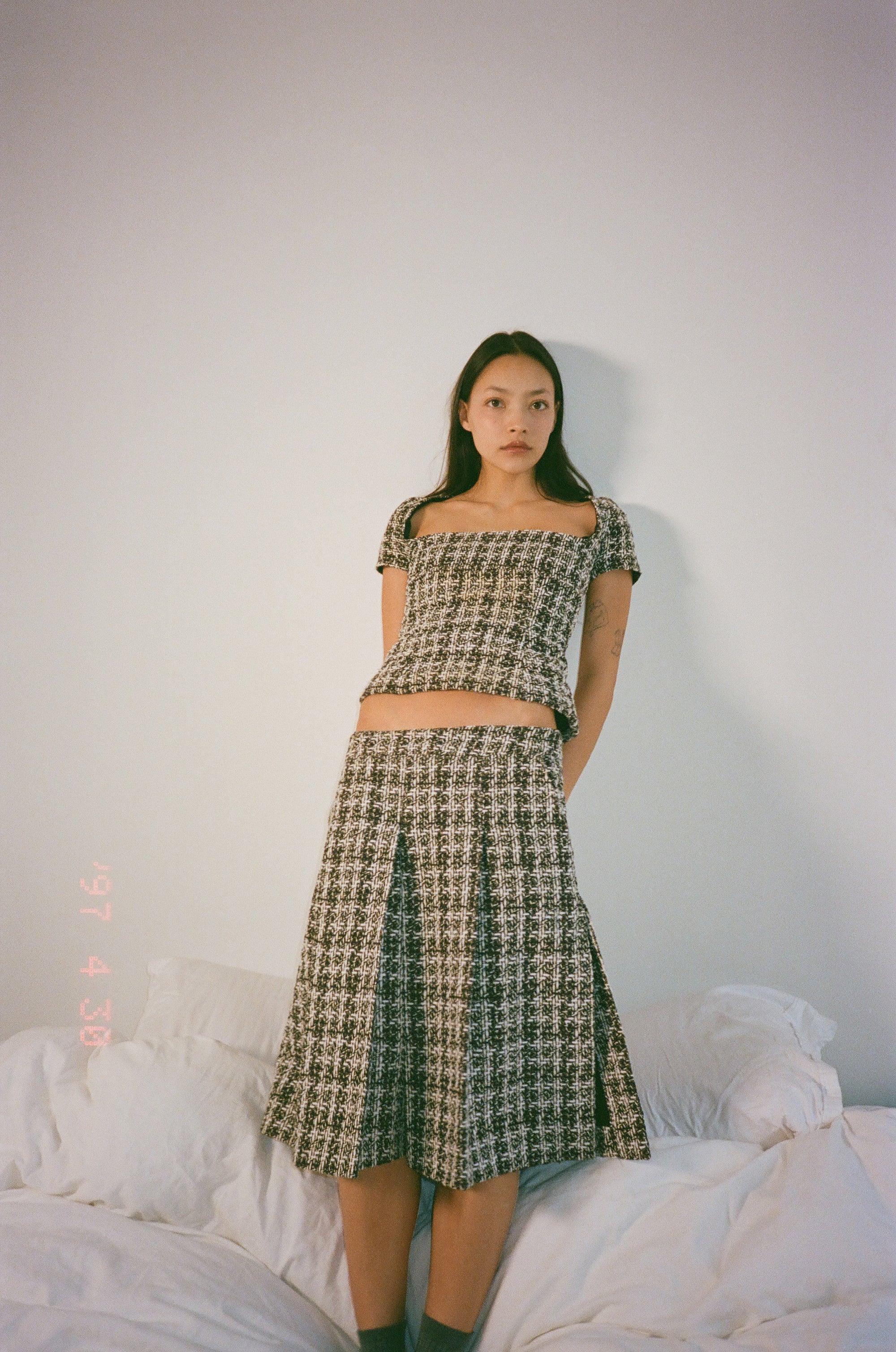 Corset top in burgundy checkered bouclé wool blend